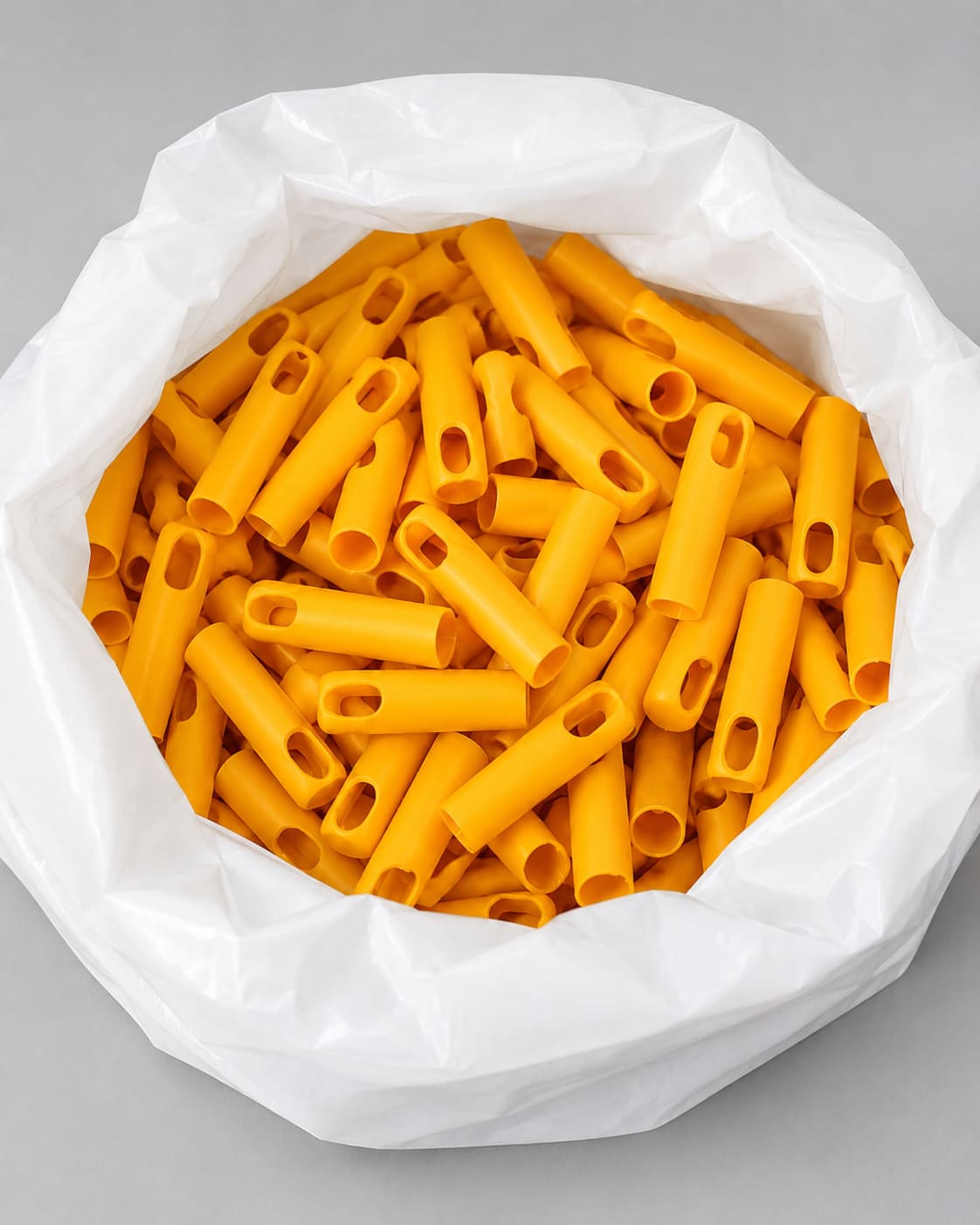 Orange metal handles packed in bags