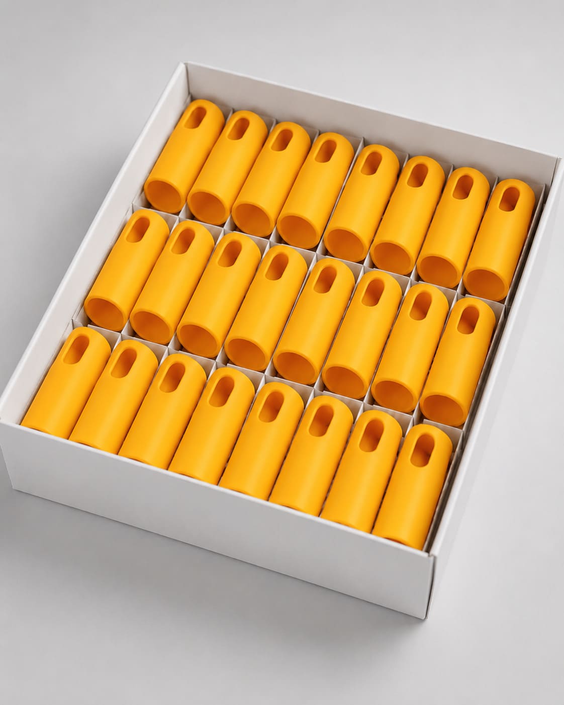 Orange metal handles packed in a branded cardboard box