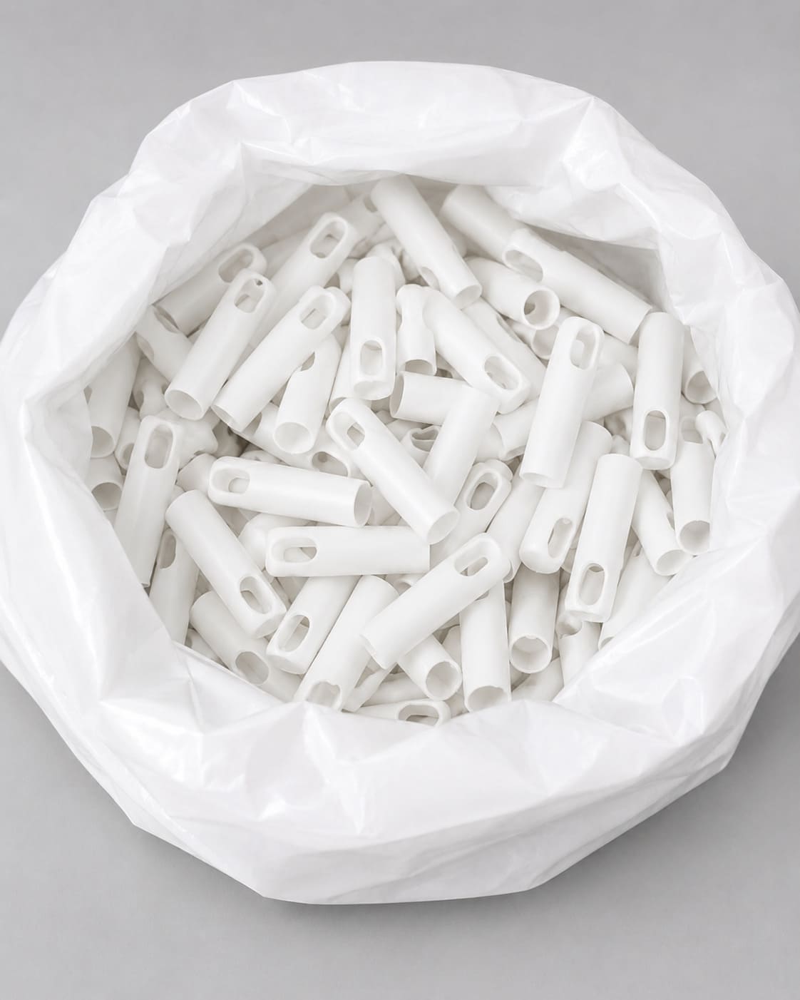 White metal handles packed in bags